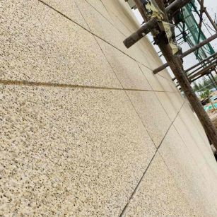 石嘴山 黄金麻花岗岩荔枝面外墙干挂石材效果示例