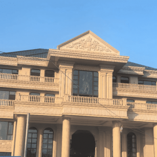 石嘴山黄金麻别墅外墙干挂石材效果示例